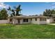 Charming single-story home featuring a well-maintained lawn and neutral-toned exterior at 417 20Th W Ave, Palmetto, FL 34221