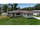 Charming single-story home with a well-manicured lawn, inviting entryway, and freshly painted exterior at 417 20Th W Ave, Palmetto, FL 34221