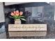 Close-up of the granite countertop with decor, flowers, and outlets at 417 20Th W Ave, Palmetto, FL 34221