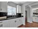 Beautiful kitchen with white cabinets, dark countertops, and hardwood flooring at 417 20Th W Ave, Palmetto, FL 34221