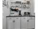 Kitchenette area with modern appliances, shelving, and decor at 417 20Th W Ave, Palmetto, FL 34221