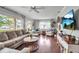Inviting living room featuring hardwood floors, natural light, and a comfortable seating arrangement at 417 20Th W Ave, Palmetto, FL 34221