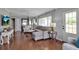 Comfortable living room featuring hardwood floors, neutral paint, and ample natural light at 417 20Th W Ave, Palmetto, FL 34221
