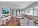 Inviting living room showcasing hardwood floors, neutral decor, and abundant natural light at 417 20Th W Ave, Palmetto, FL 34221
