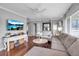 Open-concept living area with hardwood floors, white trim, and a bright, airy feel at 417 20Th W Ave, Palmetto, FL 34221