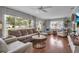 Spacious living room filled with natural light, featuring hardwood floors and modern decor at 417 20Th W Ave, Palmetto, FL 34221