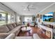 Cozy living room with hardwood floors, neutral tones, stylish decor and natural light at 417 20Th W Ave, Palmetto, FL 34221