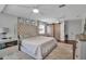Bright main bedroom showcasing a sliding barn door closet and luxurious furnishings at 417 20Th W Ave, Palmetto, FL 34221