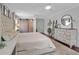 Bright main bedroom showcasing a sliding barn door closet and luxurious furnishings at 417 20Th W Ave, Palmetto, FL 34221