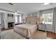 Bright main bedroom showcasing a fireplace and luxurious furnishings with accent lighting at 417 20Th W Ave, Palmetto, FL 34221