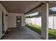 Covered patio with access to the fenced backyard at 417 20Th W Ave, Palmetto, FL 34221