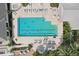Aerial shot of a community pool with lounge seating and lush landscaping, and relaxing area at 431 Fieldstone Dr, Venice, FL 34292