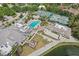Community aerial view showcasing pool, tennis courts, bocce ball, fire pit, and recreation at 431 Fieldstone Dr, Venice, FL 34292