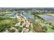 Community aerial view with lush greenery, water features, and well-maintained homes at 431 Fieldstone Dr, Venice, FL 34292