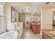 Expansive bathroom with dual vanity, soaking tub, and a shower with glass door at 431 Fieldstone Dr, Venice, FL 34292