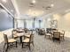 The well lit dining area features ample seating, elegant light fixture and a calm, welcoming ambiance at 431 Fieldstone Dr, Venice, FL 34292