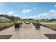 Outdoor fire pit with comfortable seating, offering relaxing community space at 431 Fieldstone Dr, Venice, FL 34292