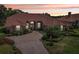 Charming home with a red tile roof, beautiful landscaping, and a brick driveway at 431 Fieldstone Dr, Venice, FL 34292