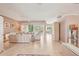 Spacious living room with tile flooring, neutral décor, and access to the screened lanai at 431 Fieldstone Dr, Venice, FL 34292