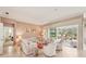 Bright living room with tile flooring, neutral furniture, and view of the outdoor lanai at 431 Fieldstone Dr, Venice, FL 34292