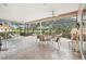 Spacious screened-in patio with golf course views perfect for relaxing or entertaining at 431 Fieldstone Dr, Venice, FL 34292
