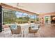 Expansive screened-in patio with hot tub, lounge chairs, and beautiful golf course views at 431 Fieldstone Dr, Venice, FL 34292
