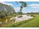 Scenic view of the pond and golf course, offering a peaceful and serene setting at 431 Fieldstone Dr, Venice, FL 34292