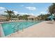 Inviting swimming pool with lounge chairs, umbrellas and a poolside cabana at 431 Fieldstone Dr, Venice, FL 34292
