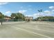 Well-maintained tennis courts with shade structures, providing a great recreational amenity at 431 Fieldstone Dr, Venice, FL 34292