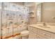 Bathroom with a white vanity, tile floor, and a tropical-themed shower curtain at 4322 Reflections Pkwy, Sarasota, FL 34233