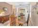 Charming dining room featuring a wooden table, woven chairs, and a buffet for elegant dining at 4322 Reflections Pkwy, Sarasota, FL 34233