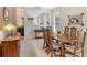 Lovely dining space featuring a wood table, seating for six, a buffet, and a view into the living room at 4322 Reflections Pkwy, Sarasota, FL 34233