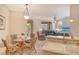 Open-concept kitchen features a cozy breakfast area, a bright living room and natural light at 4322 Reflections Pkwy, Sarasota, FL 34233