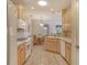 Bright eat-in kitchen featuring modern appliances, light counters and tile floors at 4322 Reflections Pkwy, Sarasota, FL 34233
