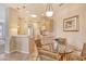 Charming eat-in kitchen area with a glass table and natural wood cabinetry at 4322 Reflections Pkwy, Sarasota, FL 34233