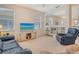 Inviting living room with cozy couches, a TV on a modern console, built-in shelving, and lots of light at 4322 Reflections Pkwy, Sarasota, FL 34233