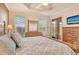 Spacious bedroom features natural light and wooden furniture at 4322 Reflections Pkwy, Sarasota, FL 34233