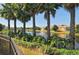Scenic pond with fountain, bordered by lush landscaping and community homes at 4322 Reflections Pkwy, Sarasota, FL 34233