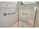 Updated shower with tiled walls, a glass door, and convenient grab bars at 4322 Reflections Pkwy, Sarasota, FL 34233