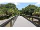 Community wooden walking bridge with scenic views at 4322 Reflections Pkwy, Sarasota, FL 34233