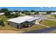Aerial view of a home showcasing its modern roof, landscaping, and neighborhood at 445 Matisse S Cir # 445, Nokomis, FL 34275