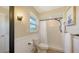 Bright bathroom featuring a shower, updated toilet, natural light, and modern lighting at 445 Matisse S Cir # 445, Nokomis, FL 34275