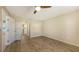 Spacious bedroom featuring hardwood floors, modern ceiling fan, natural light, and neutral paint at 445 Matisse S Cir # 445, Nokomis, FL 34275