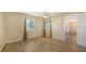 Spacious bedroom featuring hardwood floors, modern ceiling fan, natural light, and neutral paint at 445 Matisse S Cir # 445, Nokomis, FL 34275