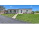 Charming home with well-manicured lawn and landscaping with paver sidewalk and driveway at 445 Matisse S Cir # 445, Nokomis, FL 34275