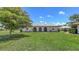 Charming single-story home with a well-manicured lawn and beautiful landscaping at 445 Matisse S Cir # 445, Nokomis, FL 34275