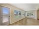 Sun-filled living room with exterior access and a large window offering plentiful natural light and outdoor views at 445 Matisse S Cir # 445, Nokomis, FL 34275