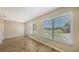 Bright living room featuring large windows with an exterior view, natural lighting, and neutral-toned walls at 445 Matisse S Cir # 445, Nokomis, FL 34275