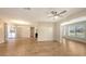 Open living room with wood-look flooring, ceiling fan, and an open concept perfect for entertaining guests at 445 Matisse S Cir # 445, Nokomis, FL 34275