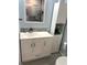 Bright bathroom features a modern vanity with extra cabinet space and a decorative backsplash at 4511 3Rd Street W Cir # 289, Bradenton, FL 34207